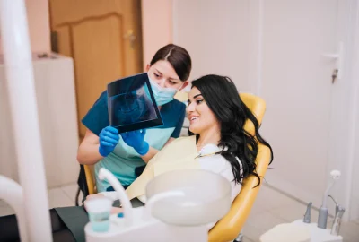 dentist-showing-teeth-x-ray-patient_23-2148085317 dentist-showing-teeth-x-ray-patient_23-2148085317